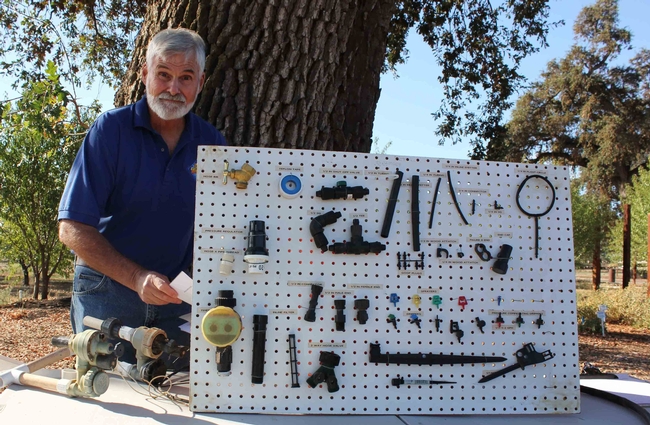 Brent McGhie shows drip irrigation components at a Master Gardener workshop