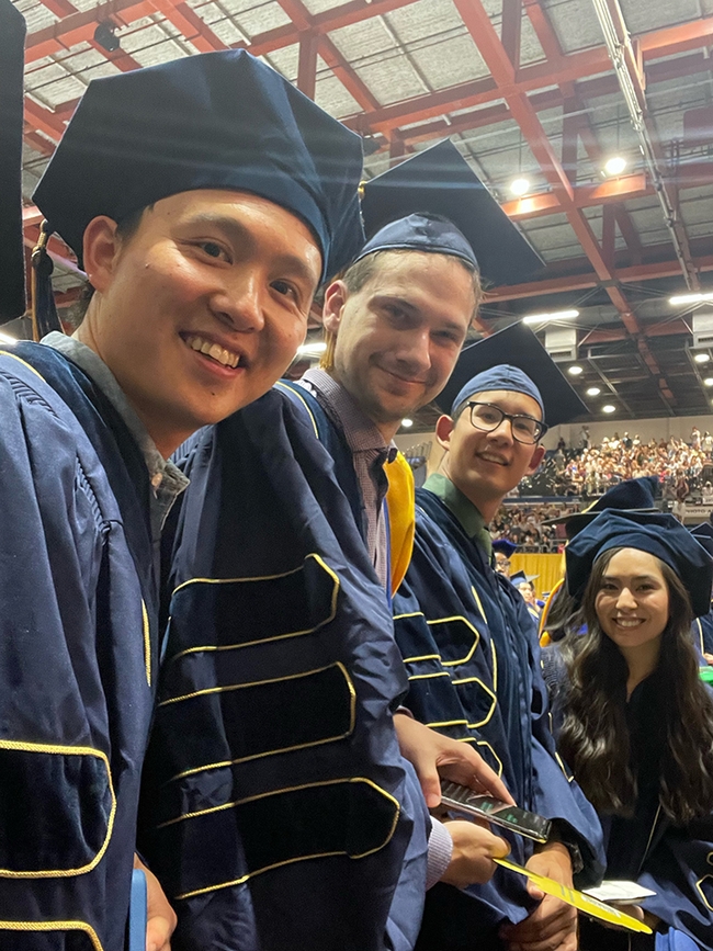 Happy moment!  From left are Yao Cai of the Joanna Chiu lab; Zachary Griebenow of the Phil War lab; and Kyle Lewald and Christine Tubuloc of the Chiu lab. All held membership in the Entomology Graduate Group, except for Lewald, a member of the Integrative Genetics and Genomics Graduate Group. (Photo by Joanna Chiu)