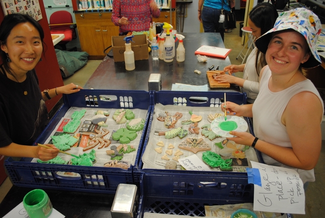 Students engaged in glazing  in the Entomology 001 class, “Art, Science and the World of Insects.