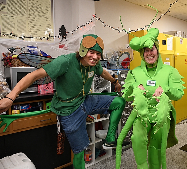 Two predators: UC Davis doctoral candidate Christofer Brothers as a green darner dragonfly, and Tabatha Yang, Bohart Museum education and outreach coordinator, as a praying mantis. (Photo by Kathy Keatley Garvey)
