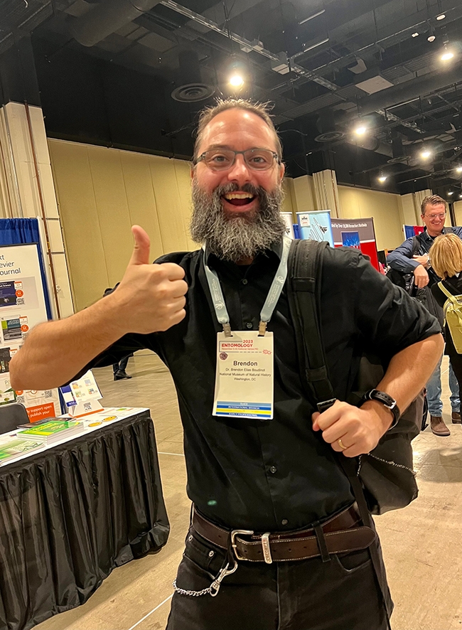 UC Davis doctoral alumnus and ant specialist Brendon Boudinot, formerly of the Phil Ward lab, and now with the National Museum of Natural History, Washington D.C., gives a thumbs up. He is a previous winner of the John Henry Comstock Award. (Photo courtesy of Jenella Loye)
