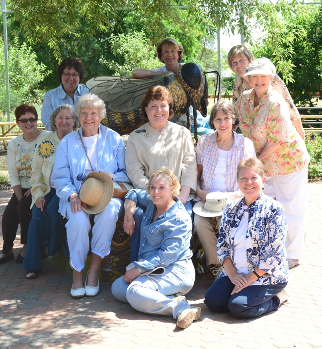 DAR Dignitaries: Seated in front are governing board members Mary Brown (left) and Donna Riegel; second row (from left) governing board members Sally Holcombe and  Midge Enke; Honorary President General Dorla Kemper;  State Regent Debbie Jamison;  and Honorary State Regent Leonora Branca. In back: project chair Karen Montgomery, and board members Gayle Mooney, Carol Jackson,  and Sandra Orozco. (UC Davis Photo by Chris Akins)