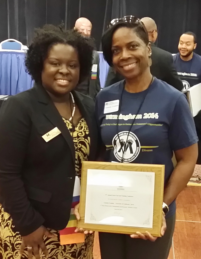 Yolanda Franklin (right) holds the plaque she won for her award-winning research presentation. With her is Candiss O. Williams, the superintendent of the Undergraduate Research Competition at the National MANRRS Conference.