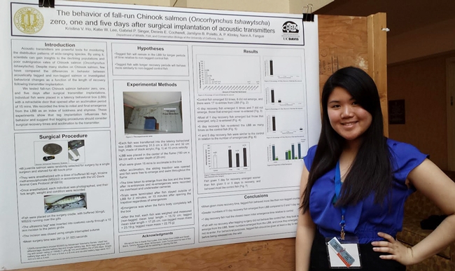 Kristina Ho stands by the prize-winning poster that she and Katie Lee did