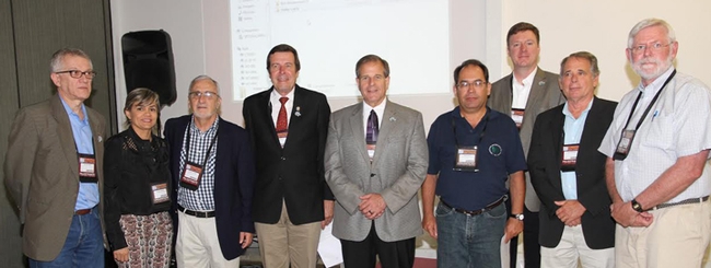 Historical moment: Walter Leal, Eliane Quintela, Antonio Panizzi, Frank Zalom, Phil Mulder, Pedro Neves, David Gammel, Grayson Brown, and Rob Widenmann. (See caption in news story.)
