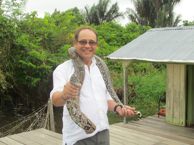 Anthony Cornel holding snake in Brazil.