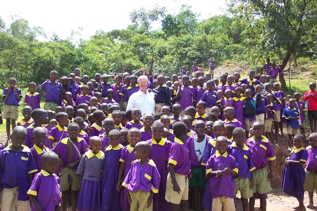 Thomas Scott with schoolchildren in Kenya in 2004. He was there to study malaria. Almost half of the children in this photo had malaria at the time. (Photo courtesy of the Thomas Scott lab)