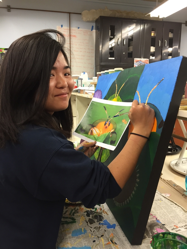 Kelly Aoyama working on a painting in the Entomology 1 class. (Photo by Diane Ullman)