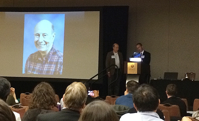 The ceremony honoring Bruce Hammock (left) as he is introduced by Darryl Zeldin, scientific director of the National Institute of Health's National Institute of Environmental Health Sciences (NIH/NIEHS).