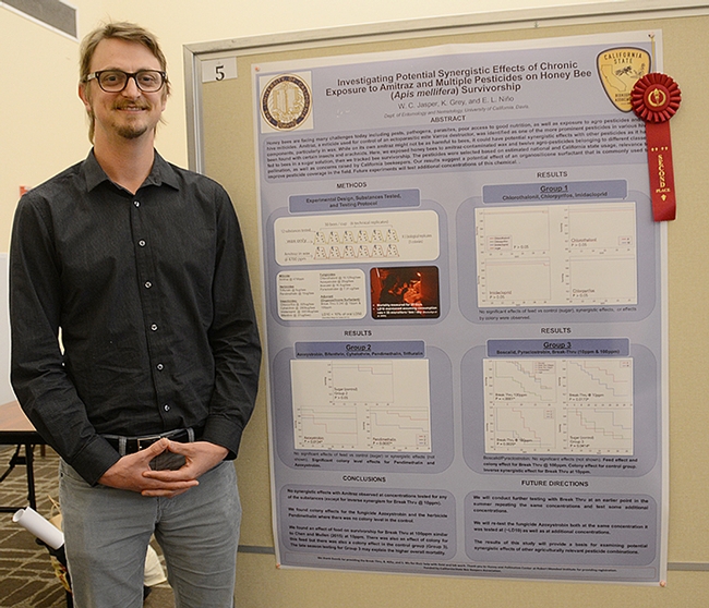 Second-place winner W. Cameron Jasper of UC Davis with his poster on pesticide exposure. (Photo by Kathy Keatley Garvey)