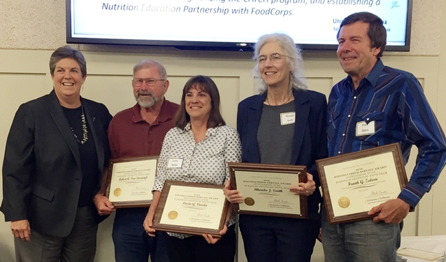 UC ANR Vice President Glenda Humiston (far left) presents the UC ANR Outstanding Team Award to the European Grapevine Moth Team. From left are Robert Van Steenwyk, Lucia Varela, Rhonda Smith and Frank Zalom. (UC ANR Photo)