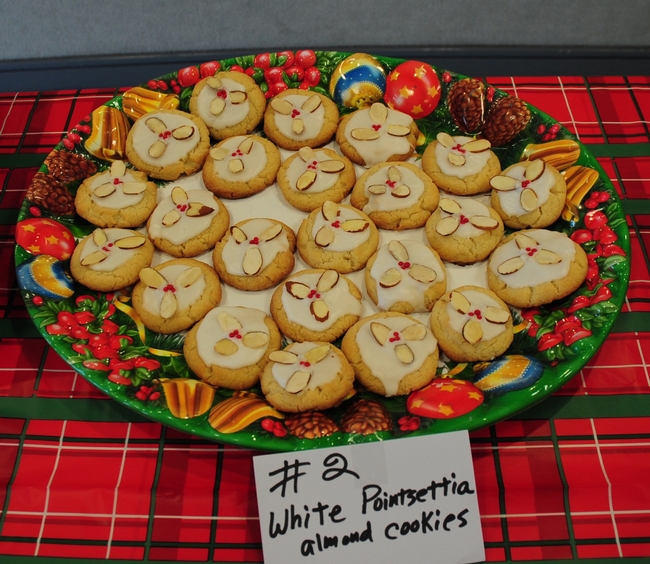 These White Poinsetta Almond Cookies, the work of cookie contest coordinator Guyla Yoak, drew oohs and aahs from the crowd. As the coordinator, she removed herself from the winners' circle. (Yoak earlier won third place in a Staff Assembly cookie contest with these decorative cookies.)