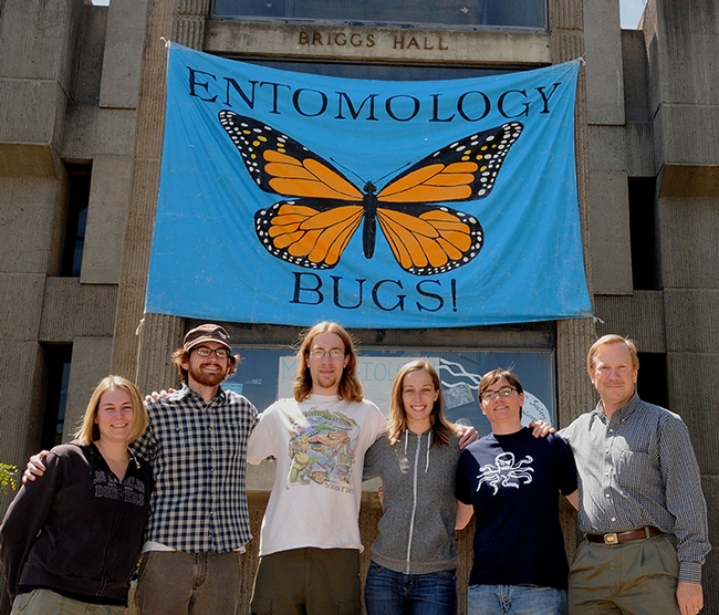 Larry Godfrey was a longtime advisor of the UC Davis Linnaean Games Team, which won regional and national championships. This is the 2010 team standing in front of Briggs Hall. From left are graduate students Emily Symmes, Andrew Merwin, Matan Shelomi, Meredith Cenzer, and Melody Schmid, and coach-advisor Larry Godfrey. (Photo by Kathy Keatley Garvey)