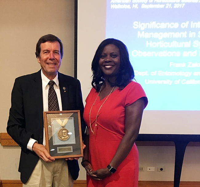 UC Davis distinguished professor Frank Zalom receives the 2017 B. Y. Morrison Medal from Chavonda Jacobs-Young, the USDA-ARS administrator, at a ceremony in Waikoloa, Hawaii.