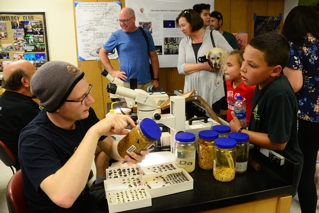Doctoral student and nematologist Corwin Parker talks to visitors about nematodes in 122 Briggs Hall. (Photo by Kathy Keatley Garvey)