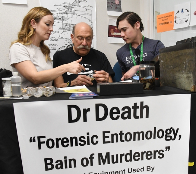 Forensic entomologist Robert Kimsey (center) talks research on blow flies with Alex Dedmon, graduate student in his lab, and Danielle Wishon, former student. (Photo by Kathy Keatley Garvey)