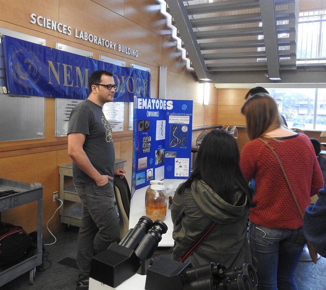 Graduate student and nematologist Christopher Pagan talks to the crowd at UC Davis Biodiversity Museum Day. (Photo by Kathy keatley Garvey)