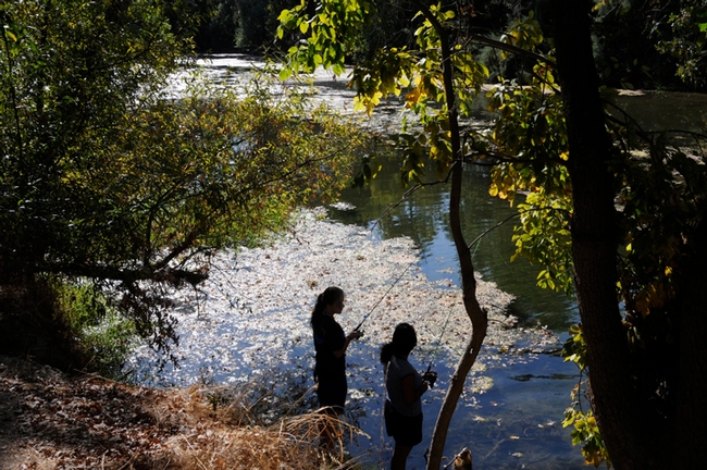 Two students in the animal biology class try their luck at fishing. (Photo by Kathy Keatley Garvey)
