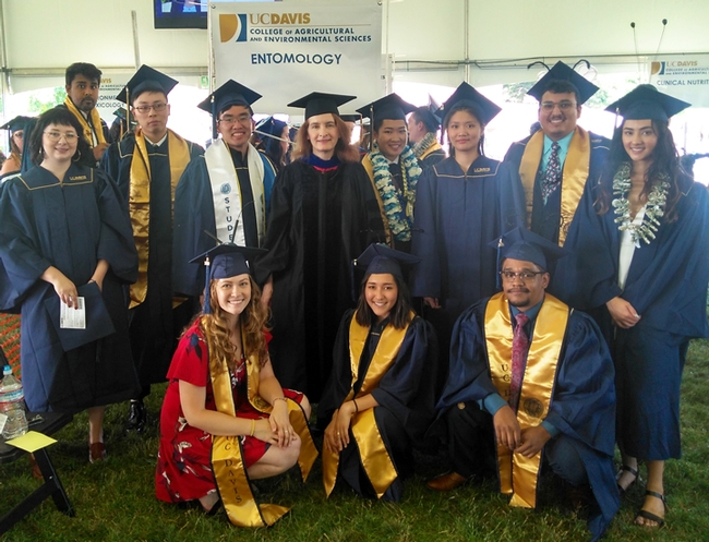 This is the Department of Entomology and Nematology's Class of 2019, with faculty advisor Sharon Lawler, professor of entomology. In front (from left) are Eliza Litsey, Jessica Nguyen and Abram Estrada. In the second row (from left) are Darian Buckman, Lohitashwa Garikipati (without mortarboard and partially hidden), Dingyuan Peng, Seiji Yokota,  faculty advisor Sharon Lawler, Michelle Tam, Jo Hsuan Kao, Matthew Salvador, and  Rayanh Gutierrez. Not pictured is Jesus Martinez Rodriguez.