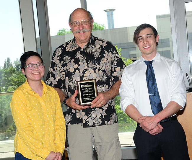 Robert Kimsey is flanked by former student Ivana Li and doctoral student Alex Dedmon at a ceremony honoring him for winning the 2019 Eleanor and Harry Walker Faculty Advising Award from the College of Agricultural and Environmental Sciences. He has just been named the recipient of the UC Davis Outstanding Faculty Advising Award. (Photo by Kathy Keatley Garvey)