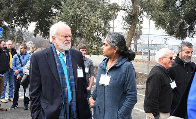 Kevin Hackett, national program leader, USDA-ARS, discusses bee research with research entomologist Arathi Seshadri. (Photo by Kathy Keatley Garvey)
