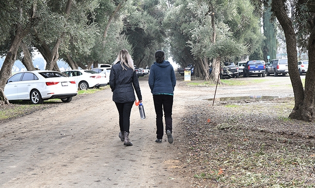 At the end of the ceremony, research entomologists Julia Fine (left) and Arathi Seshadri walk to the stakeholders' meeting at the Laidlaw facility. (Photo by Kathy Keatley Garvey)