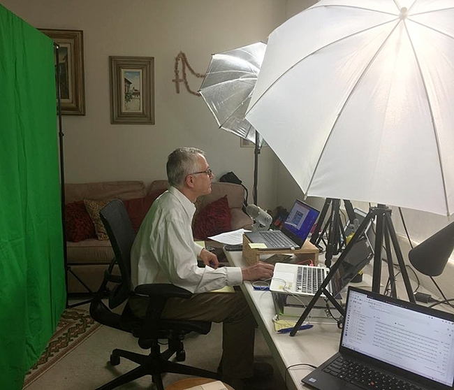 UC Davis distinguished professor Walter Leal at work on one of his COVID-19 webinars.