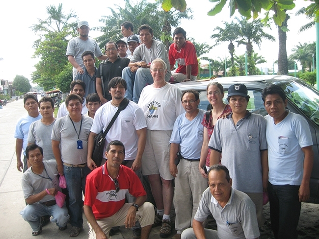 UC Davis medical entomologist Thomas Scott (center) and project scientist Amy Morrison and a prior team in Iquitos. (Archived photo courtesy of Tom Scott)