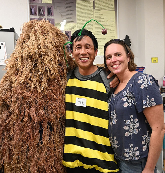 Forensic entomologist Robert Kimsey, dressed in a ghilie suit, poses with former Bohart Museum student employees Yik Lam of Raleigh, N.C., and Sara Woodworth  of Kihei, Hawaii. (Photo by Kathy Keatley Garvey)