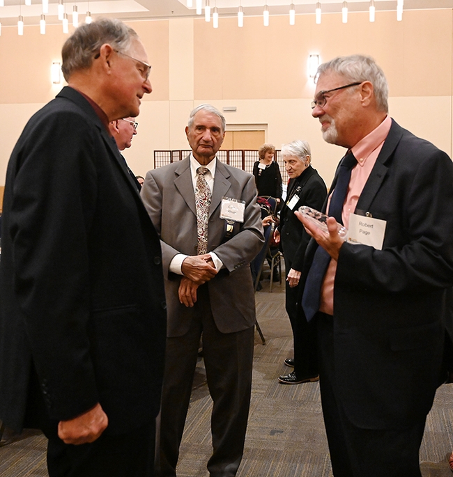 Honey bee geneticist Robert E. Page Jr. (right) receives congratulations following the awards ceremony. (Photo by Kathy Keatley Garvey)