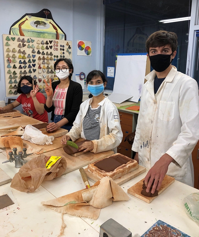 Working on clay molds are UC Davis students (from right to left) Ryan Meadows, Ashley Valdez, Heidi Tejeda Mata, and Imagine Morales.