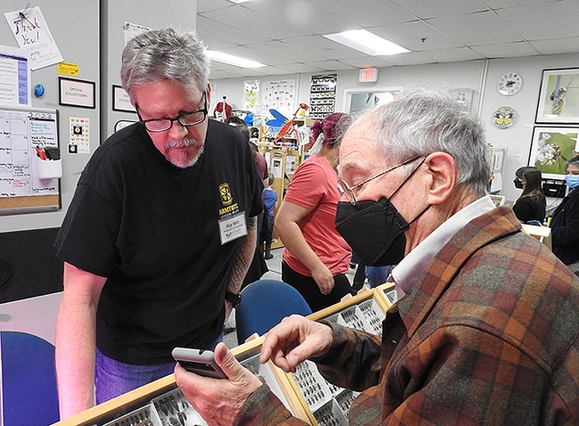 Insect enthusiast Larry Snyder (right) of Davis confers with Kipling 