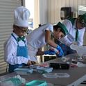 4-H members participating in Cupcake Wars are tasked with decorating cupcakes according to a certain theme and presenting them to judges.