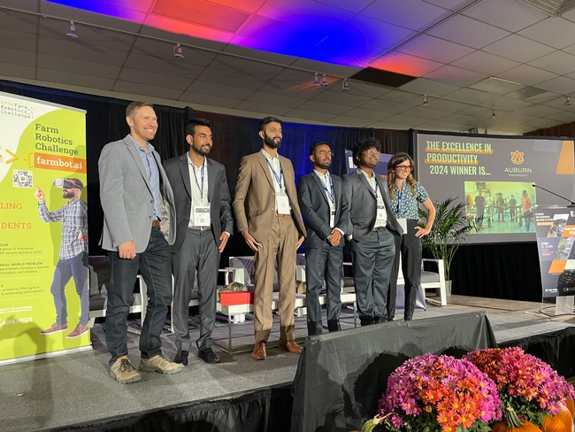 Auburn University Farm Robotics Challenge participants accept award at FIRA USA