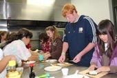 4-H participants learn to make sushi. The public health report says 53% of Huntington Park youth are overweight. Alston says federal farm subsidies have little effect on obesity.