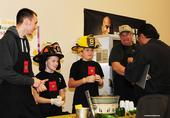 The 4-Alarm Chili Team of the Dixon Ridge 4-H Club and the newly formed Pleasants Valley 4-H Club, watches as judge John Vasquez Jr. samples their dish.  From left are Randy Marley, “captain” Cody Ceremony and “driver” Justin Means. In back (at right) is Justin’s uncle, Chuck Means, who provided the recipe and the firefighter uniforms. Chuck Means is an engineer with Sacramento Metropolitan Fire District and a co-community leader of the Dixon Ridge 4-H Club. (Photo by Kathy Keatley Garvey)