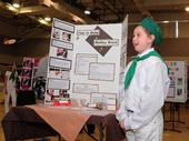 Second-year 4-H'er Maya Farris, 9, of Vacaville, answers questions about her monkey bread display at the Solano County 4-H Presentation Day. (Photo by Kathy Keatley Garvey)