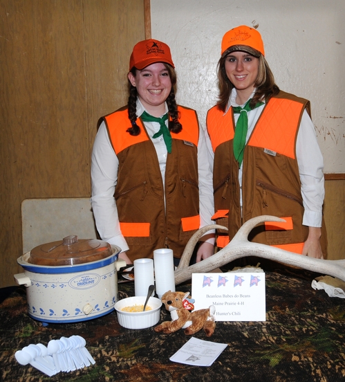 Lauren Kett (left) and Rebecca Ivanusich of the Maine Prairie 4-H Club, Dixon, dressed as hunters and served 