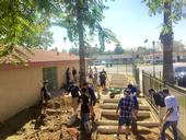 UC Riverside student volunteers, recruited by Global Food Intiative Fellow Claudia Villegas, set up new garden beds at the Community Settlement Association.