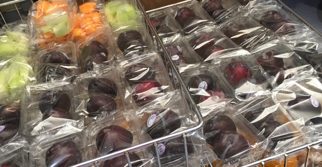 Melon and plums are packaged for schools. New USDA rules call for snacks served at school to meet nutritional standards similar to those required of school meals.