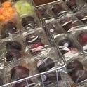 Melon and plums are packaged for schools. New USDA rules call for snacks served at school to meet nutritional standards similar to those required of school meals.