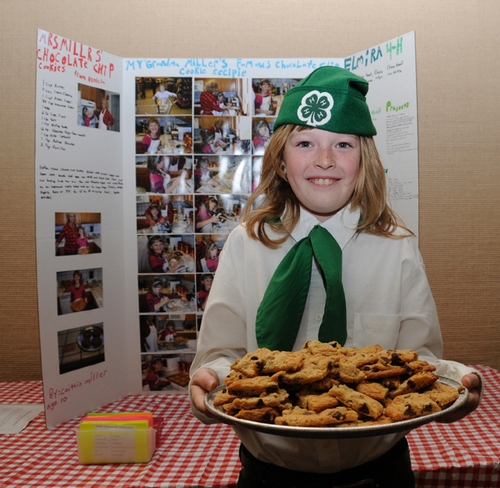 ELMIRA 4-H CLUB member Caitlin Miller offers a plate of chocolate chip cookies at the Solano County 4-H Presentation Day. The secret ingredient that keeps the cookies soft: cream cheese. (Photo by Kathy Keatley Garvey)