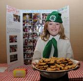 ELMIRA 4-H CLUB member Caitlin Miller offers a plate of chocolate chip cookies at the Solano County 4-H Presentation Day. The secret ingredient that keeps the cookies soft: cream cheese. (Photo by Kathy Keatley Garvey)