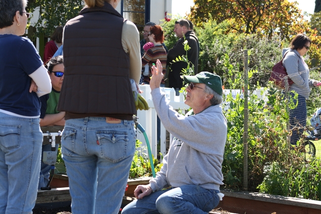 Mike G., UC Master Gardener volunteer in Solano County, shows participants irrigation parts for their home vegetable garden. (Photo: Jennifer Baumbach)
