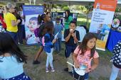 UC ANR's EFNEP program staffed a booth along with the UC Master Food Preserver Program at the Million Meals Summer picnic for Sacramento youth.