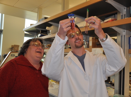 Cynthia Larive and Daniel Orr examine pomegranate juice.