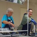 Master Food Preserver Barbara Mattice, left, helped Mosbacher demonstrate citrus preservation in class.
