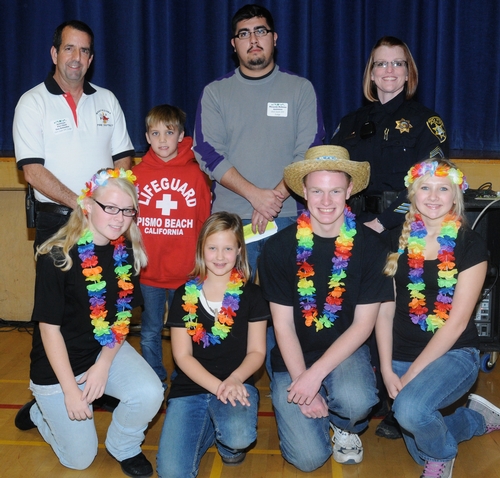 WINNING CHILI TEAM poses for a photo with the judges. In front (from left) are Hannah Crawford-Stewart, Madison Pitto, Spencer Currey and Kaylee Lindgren. In back (from left) are Assistant Fire Chief Dan Schindler of the Montezuma Fire Protection District, Rio Vista, and his assistant, son Mason Schindler, 8; chef Riccardo Bahena Antunez whose family owns the Taqueria Mexico Restaurant, Rio Vista; and Detective Vicki Rister of the Rio Vista Police Department. (Photo by Kathy Keatley Garvey)