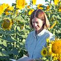 Rachael Long takes notes on sunflower seed production.