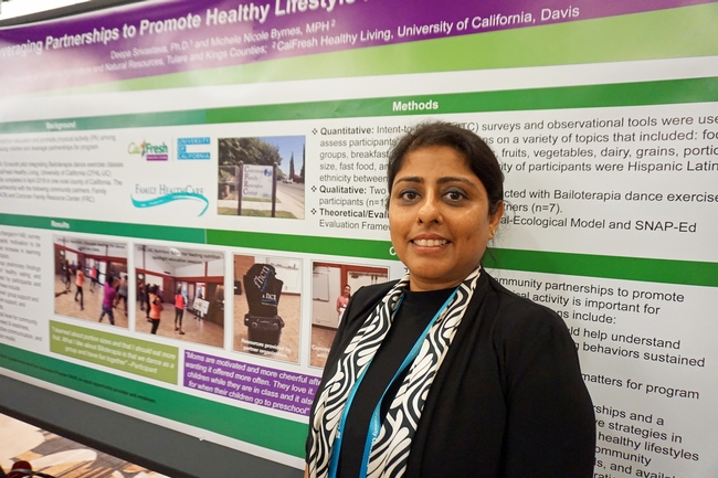 UCCE nutrition, family and consumer sciences advisor Deepa Srivastava in front of one of the posters she presented at the California Childhood Obesity Conference.